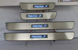 JMT Накладки на дверные пороги с логотипом и LED подсветкой, нерж. MAZDA (мазда) 3 05-09 - Автоаксессуары и тюнинг